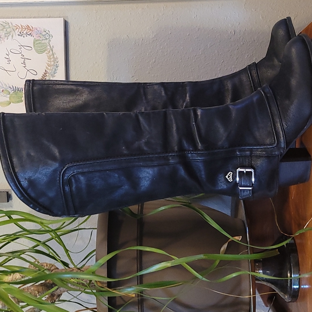 Knee high black heeled boots